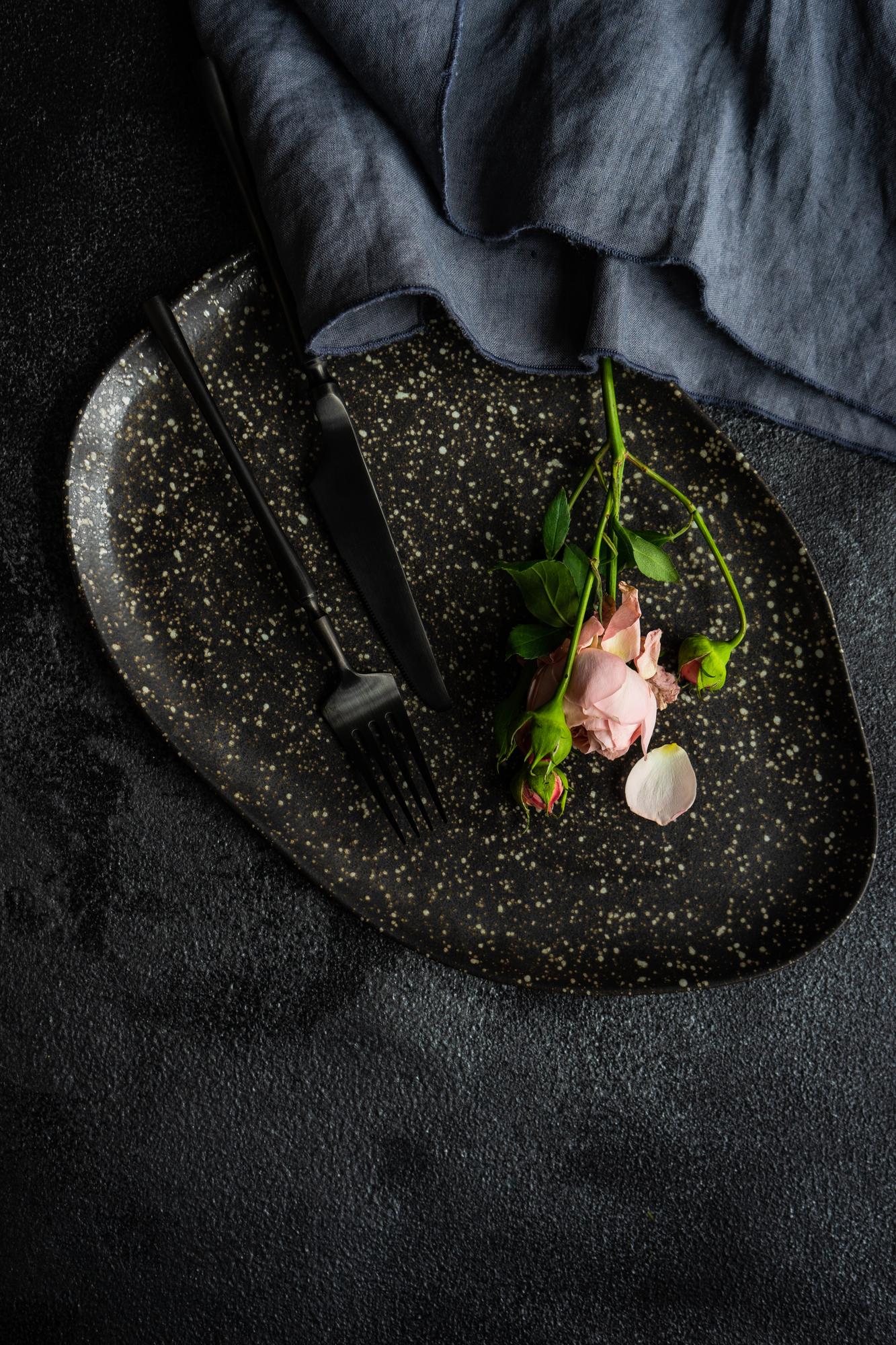 Fine dining plated dish on dark marble